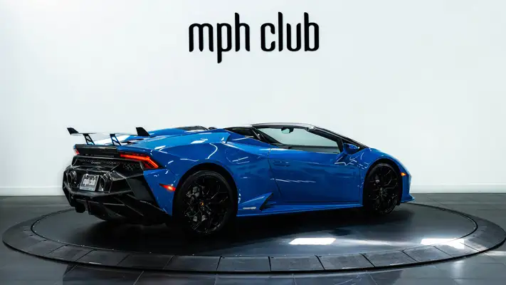 Blue Lamborghini Huracan EVO Spyder rental rear view - mph club