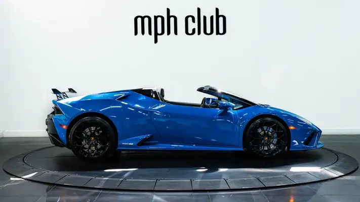 Blue Lamborghini Huracan EVO Spyder rental side view - mph club